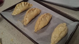 Place pastry parcels on a lined baking tray.